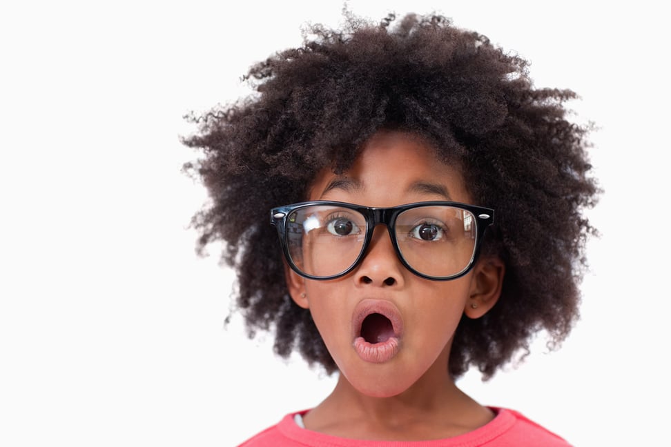 Close up of a shocked smart girl against a white background-1 Close up of a shocked smart girl against a white background-1